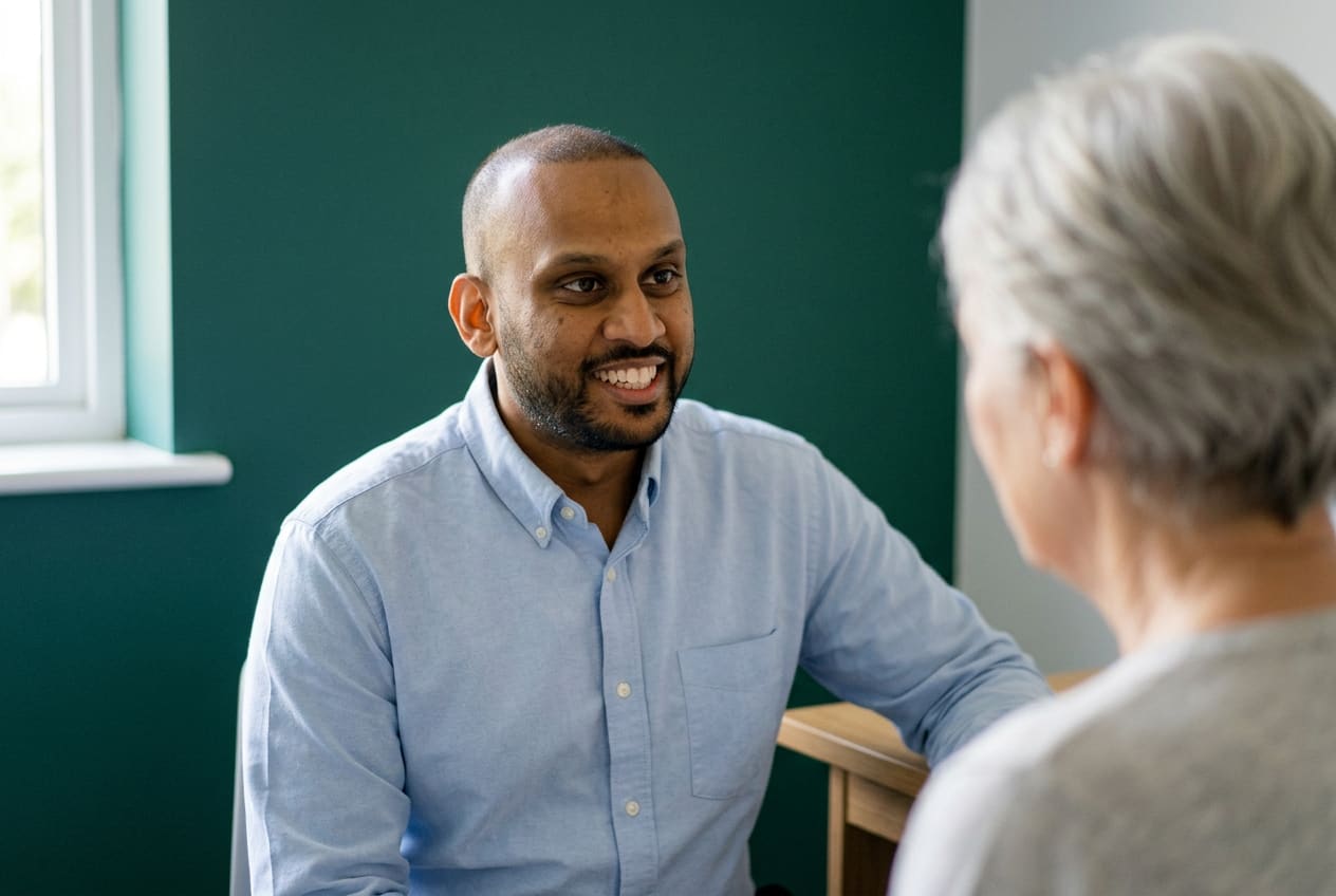 Nexus pharmacist consulting with a patient about medication at the pharmacy counter